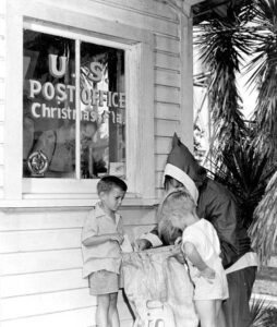 Two kids in Christmas Florida getting their packages wish list sent to the North Pole