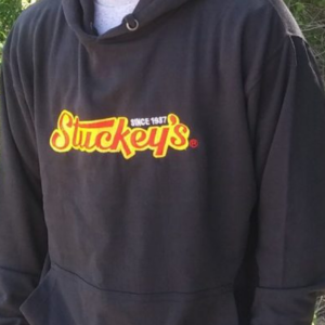 Picture of the front of a black Stuckey's embroidered hoodie.