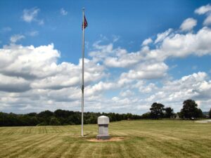Photo showing monument to Bridge burners who were hanged and buried in the area.