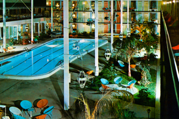 Picture postcard of Continental Inn and swimming pool.